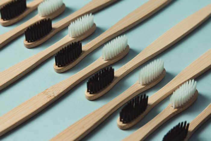 A row of bamboo toothbrushes