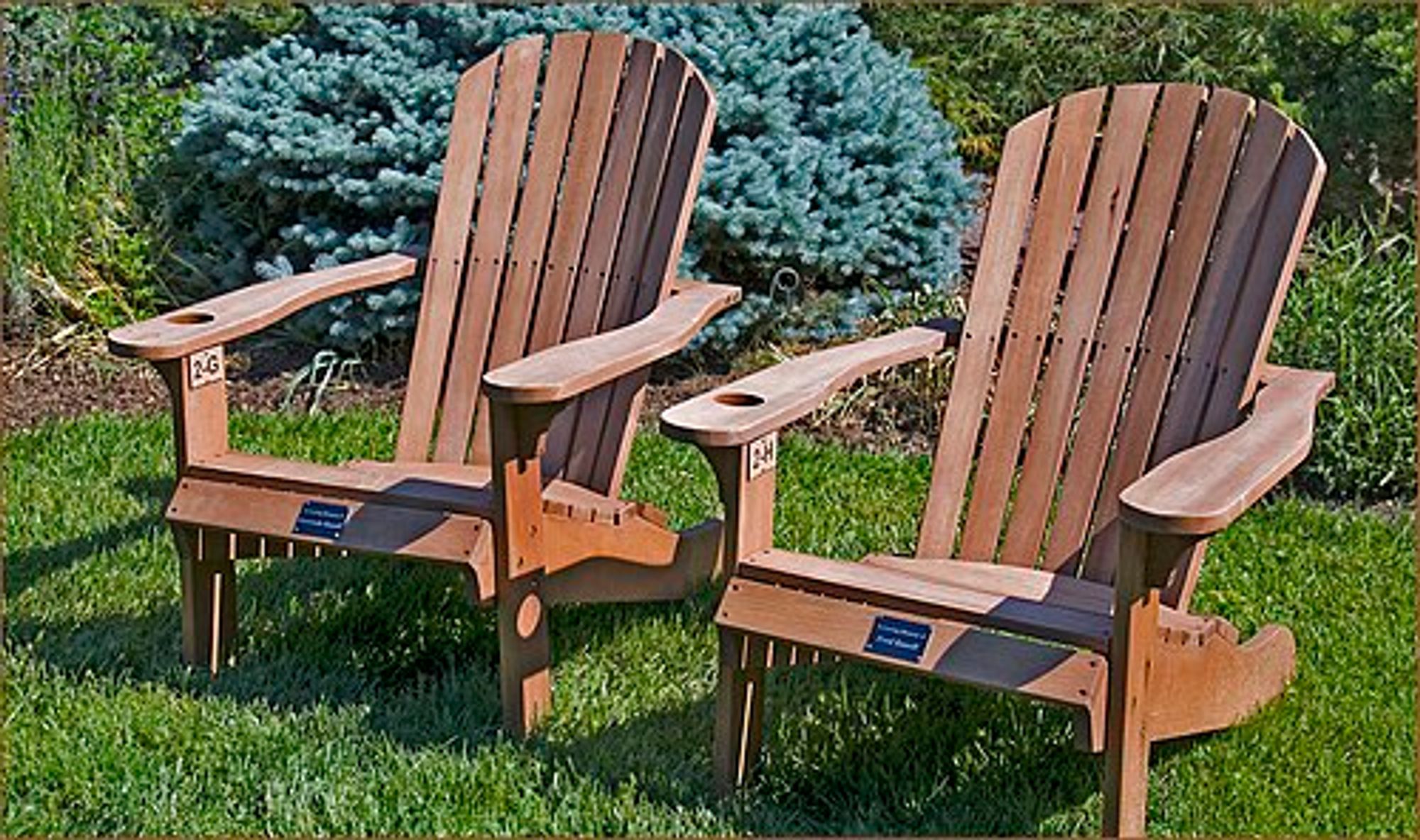 Two wooden Adirondack chairs on the lawn at Meadowlark Botanical Gardens
