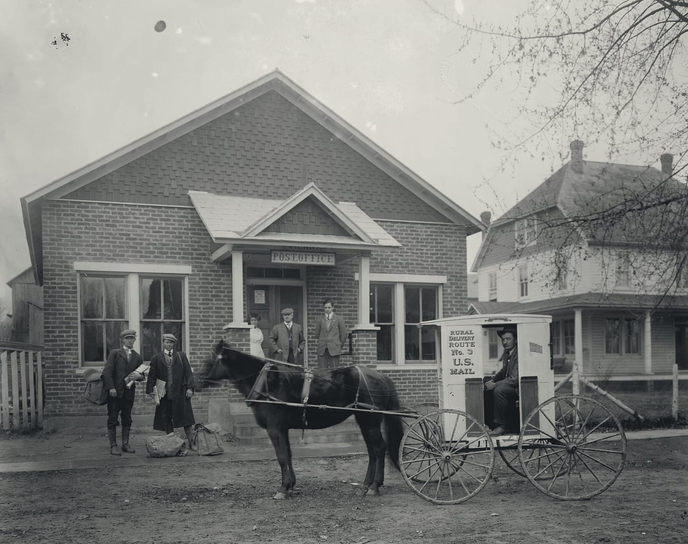 Vienna's brick post office with a horse-drawn mail wagon, early twentieth century